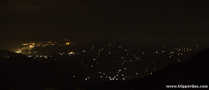 The lights of Sikkim on the opposite mountain. Try to locate the heart sign :)